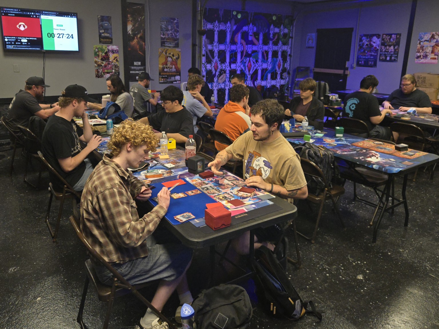 Players enjoying trading card games together at Alt Art TCG
